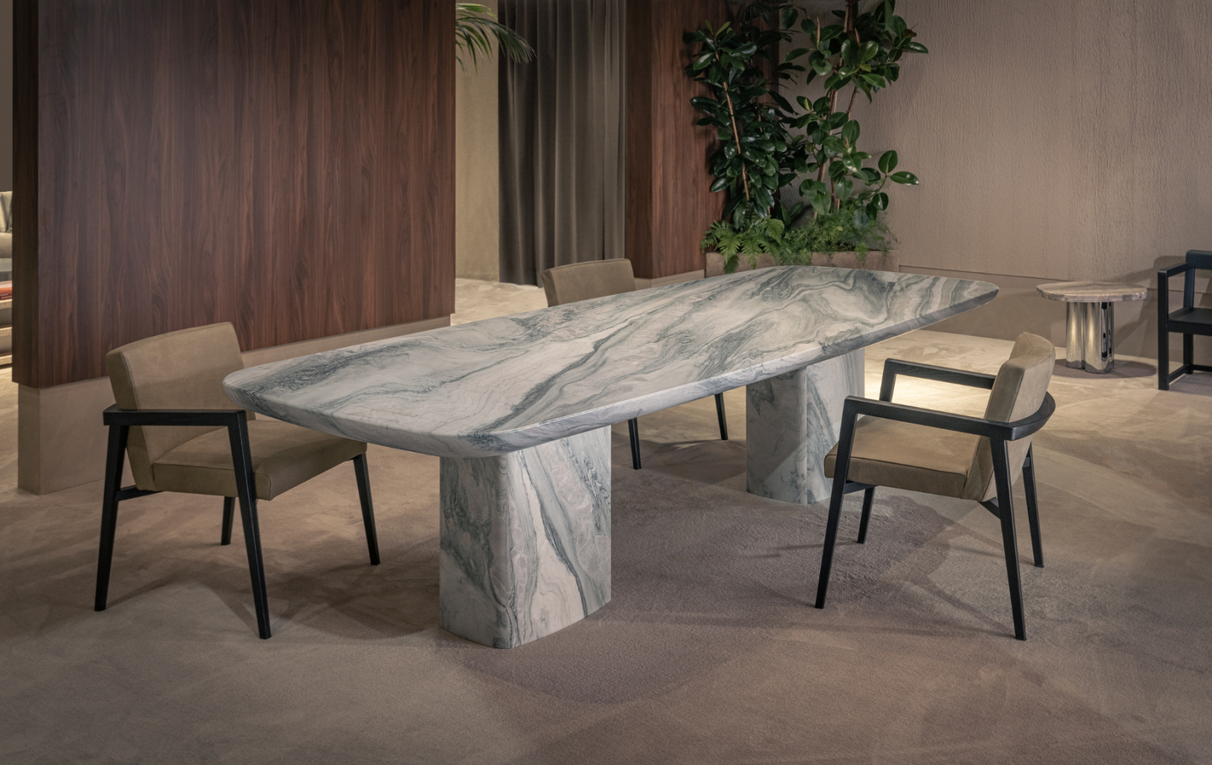Interior view of a long marble dining table with two chairs.