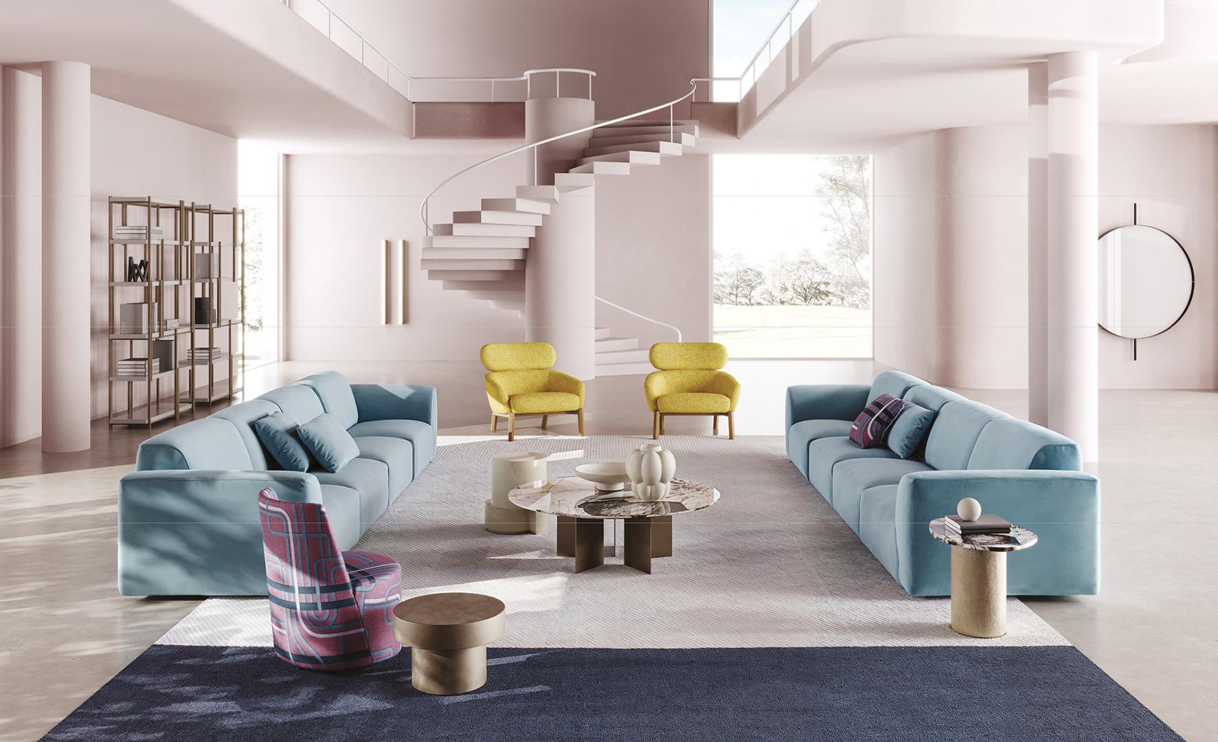 Modern living room featuring a blue sofa, yellow Casamilano Lea armchairs, marble coffee table, and spiral staircase. Luxury interior design