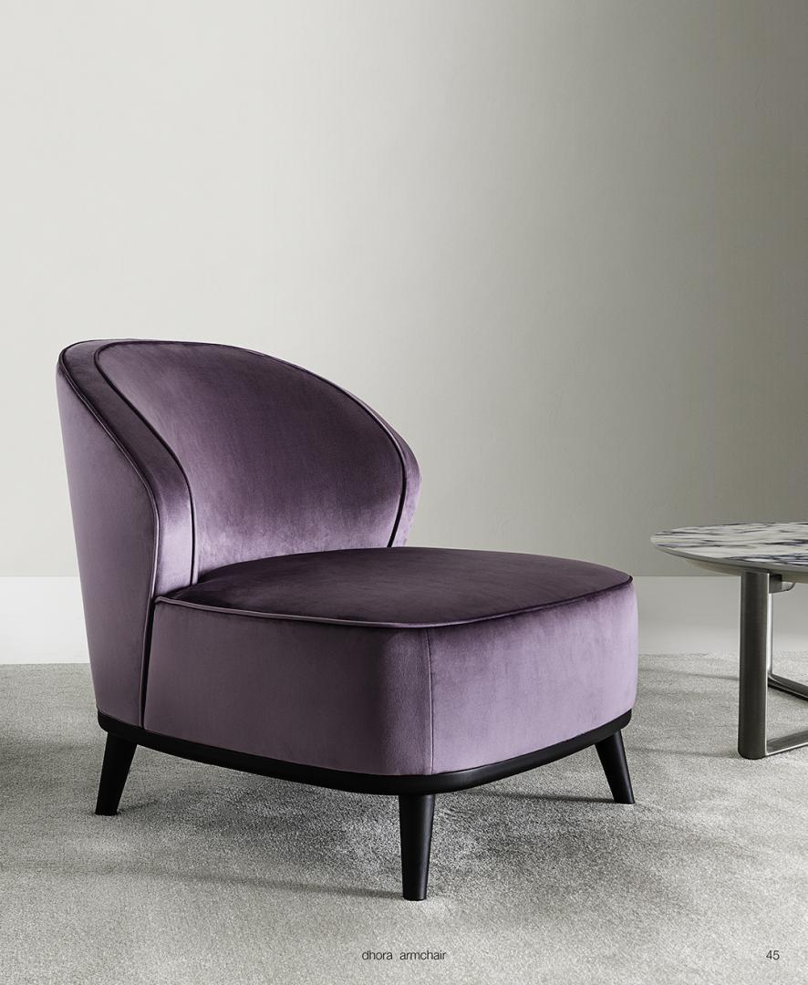 Interior view of the Casamilano Dhora armchair in purple velvet, a modern and luxurious accent chair with sleek black legs