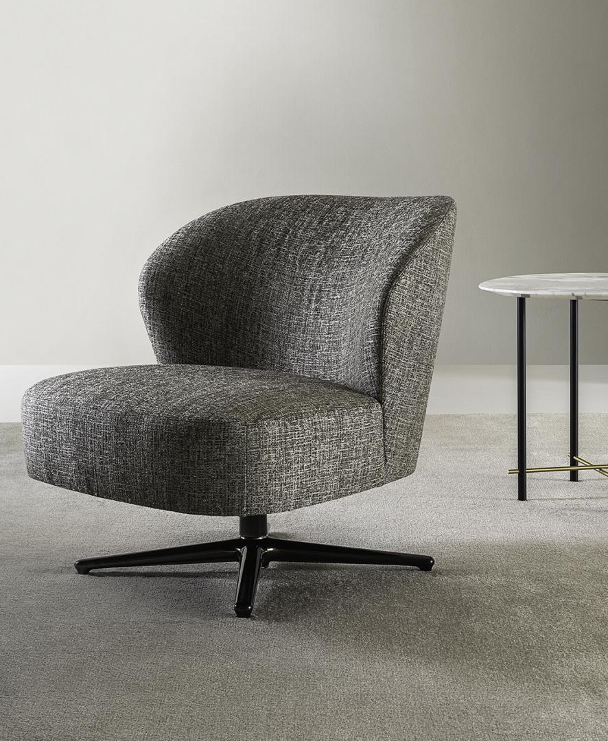 Gray Casamilano Dhora Slim swivel armchair with black base and marble side table. Modern accent chair for living room, office, or lounge.