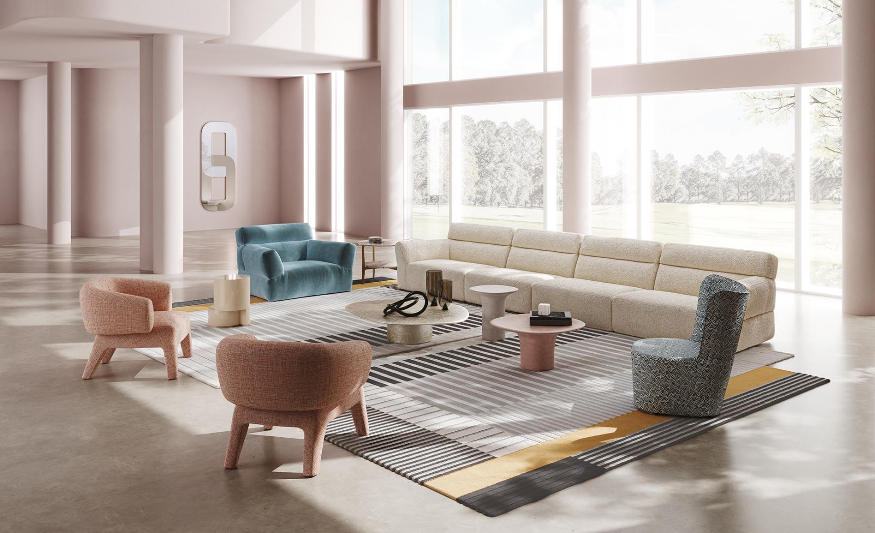 Modern living room featuring a cream sofa, peach & blue armchairs, geometric rug, & Casamilano Lola armchair. Natural light floods the minimalist design