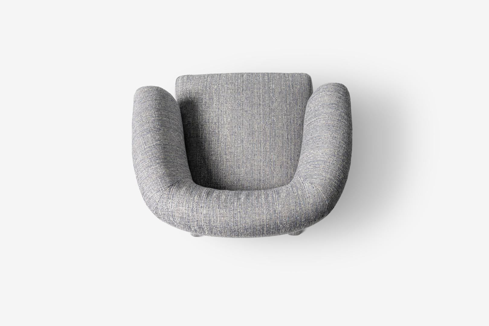 Top-down studio shot of the Casamilano Lola armchair in gray. Modern design, comfortable seating, and stylish accent chair for home decor