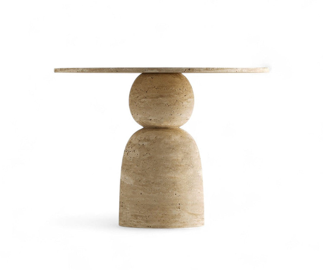 Travertine dining table with round top and stacked base on white background