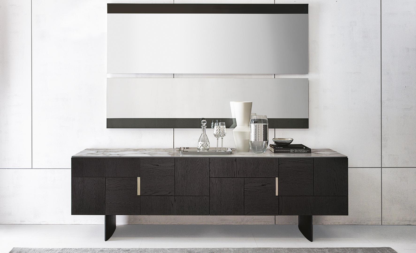 Modern living room featuring a Casamilano Arne Sideboard with dark wood, marble top, glassware, and mirror for stylish home decor