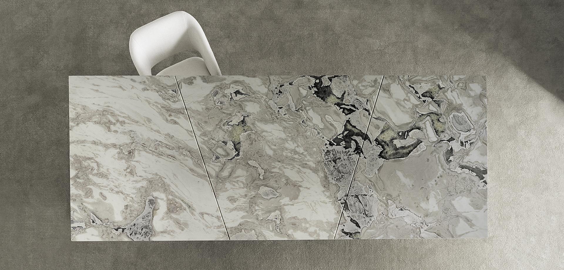 Overhead view of the Casamilano Karl dining table with marble top and white chair. Modern, luxury furniture for contemporary dining rooms