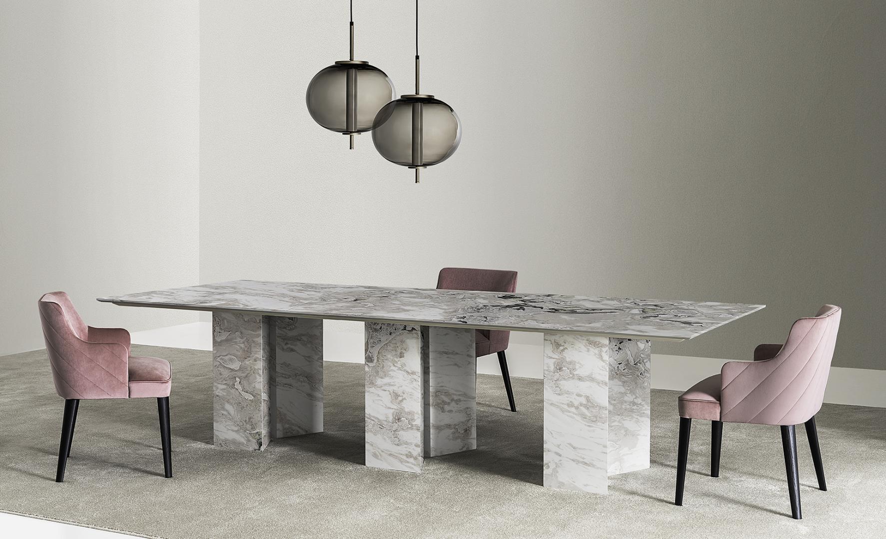 Modern dining room featuring a Casamilano Karl marble dining table with upholstered chairs, creating a luxurious and inviting dining space