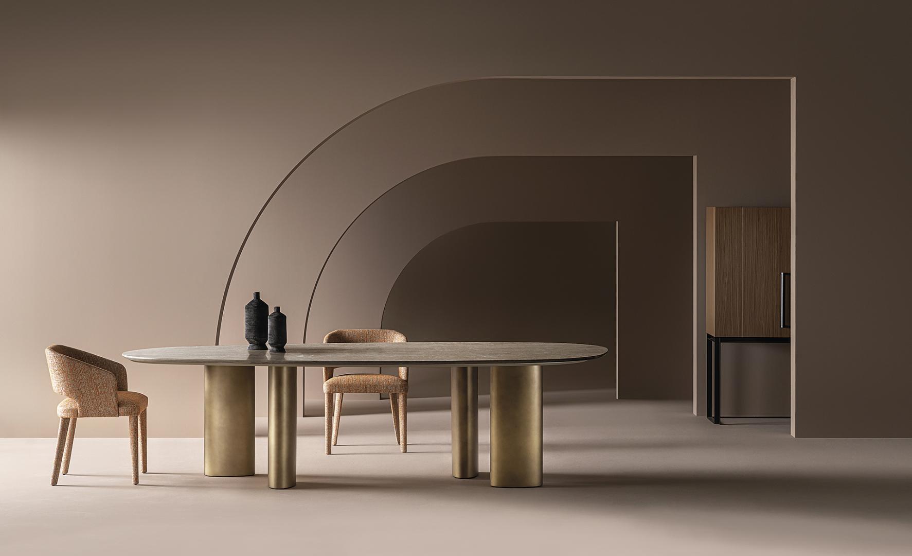 Modern dining room featuring a stone-topped table, gold legs, upholstered Casamilano Elsa dining chairs, and minimalist decor