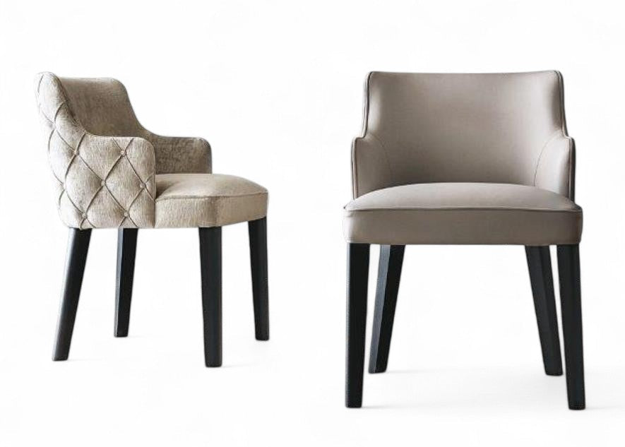 Studio view of two upholstered dining chairs with dark legs, one tufted, one plain. Dining room furniture, upholstered seating, modern chairs, neutral fabric, dark wood legs.