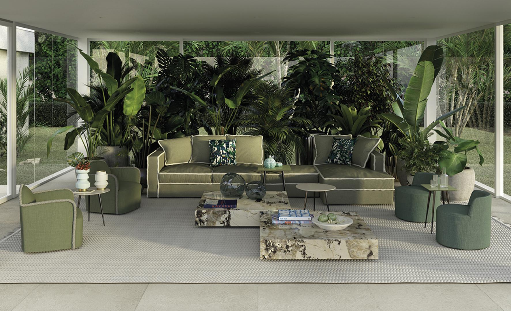 Elegant living room featuring a green sectional sofa, marble Ishi coffee table by Casamilano, armchairs, and lush indoor plants, creating a serene, luxury space