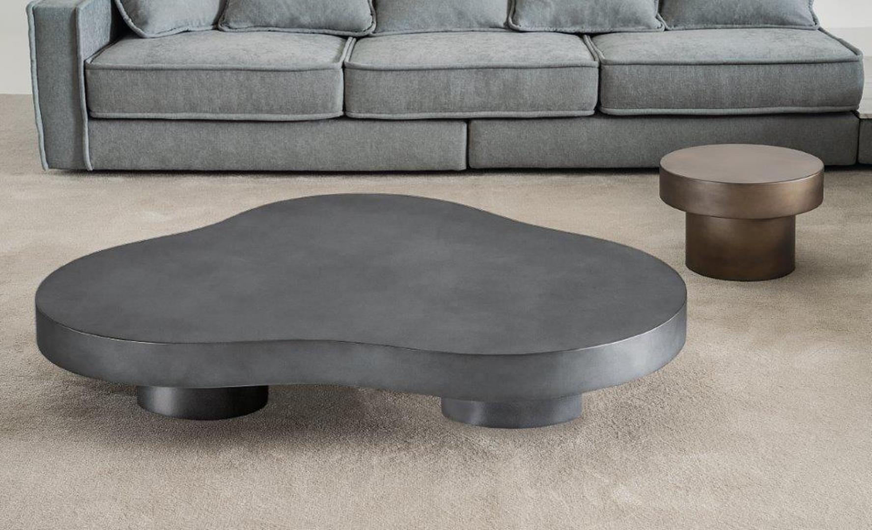 Interior with Casamilano Nuvola coffee table, metal side table, and gray sofa showcasing modern living room design