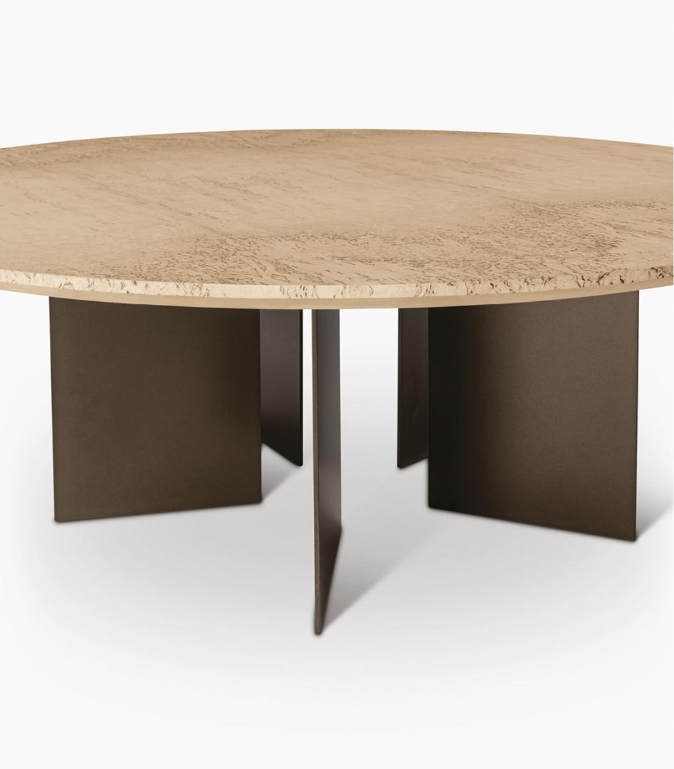 Close-up of the Vito dining table by Casamilano, featuring a textured light tabletop and dark metal base. Perfect for modern dining or living spaces