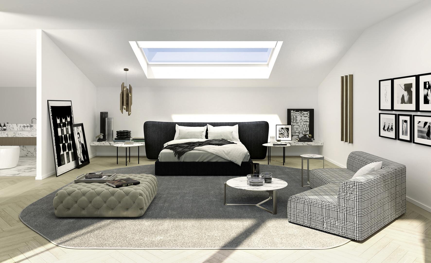 Interior of a modern attic bedroom and bathroom featuring a black bed frame, upholstered Casamilano Hyatt 120 pouf.