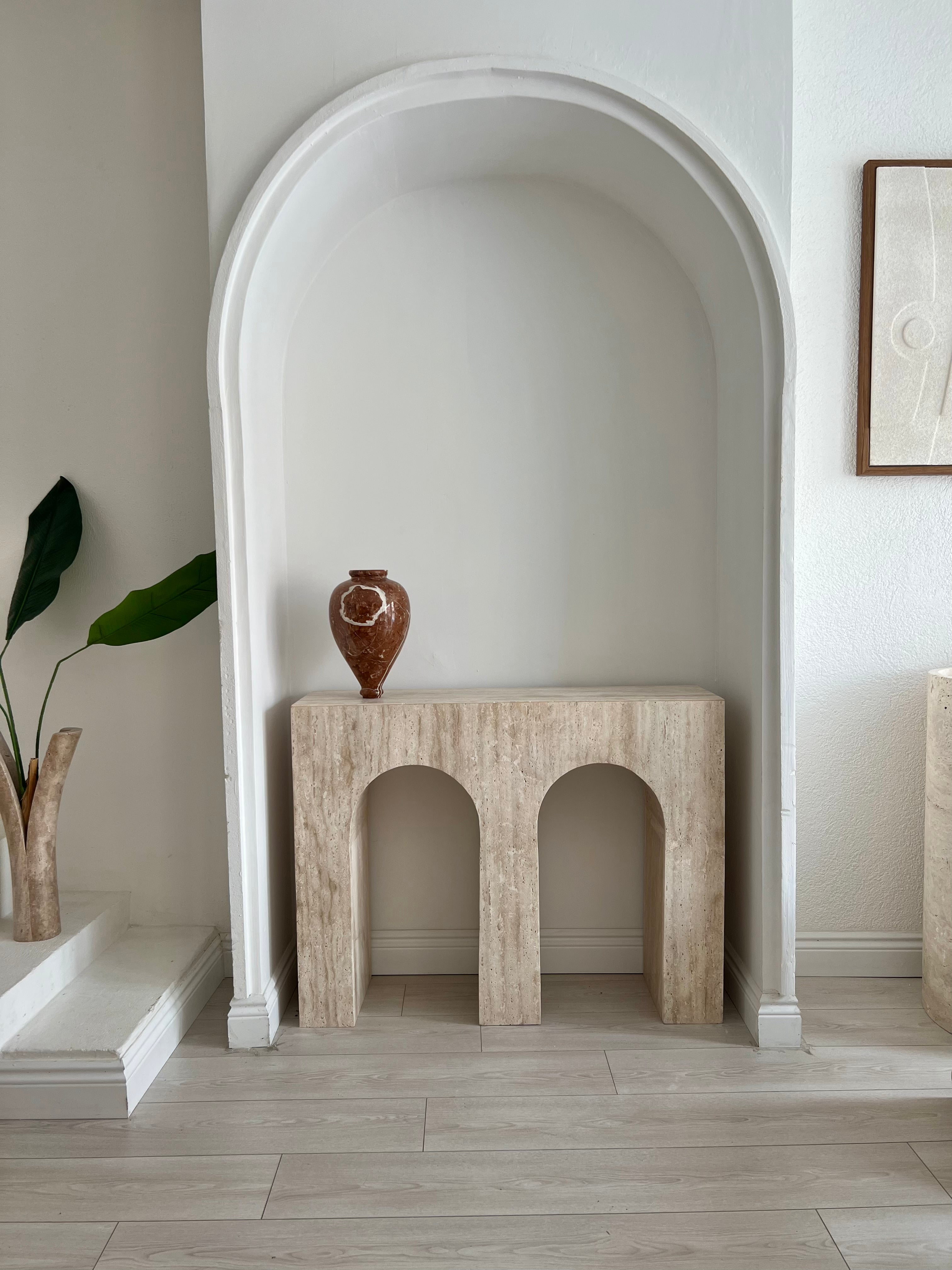 Luzione Halcyon Bridge Design Travertine Console Table in a modern living space with clean lines and natural materials