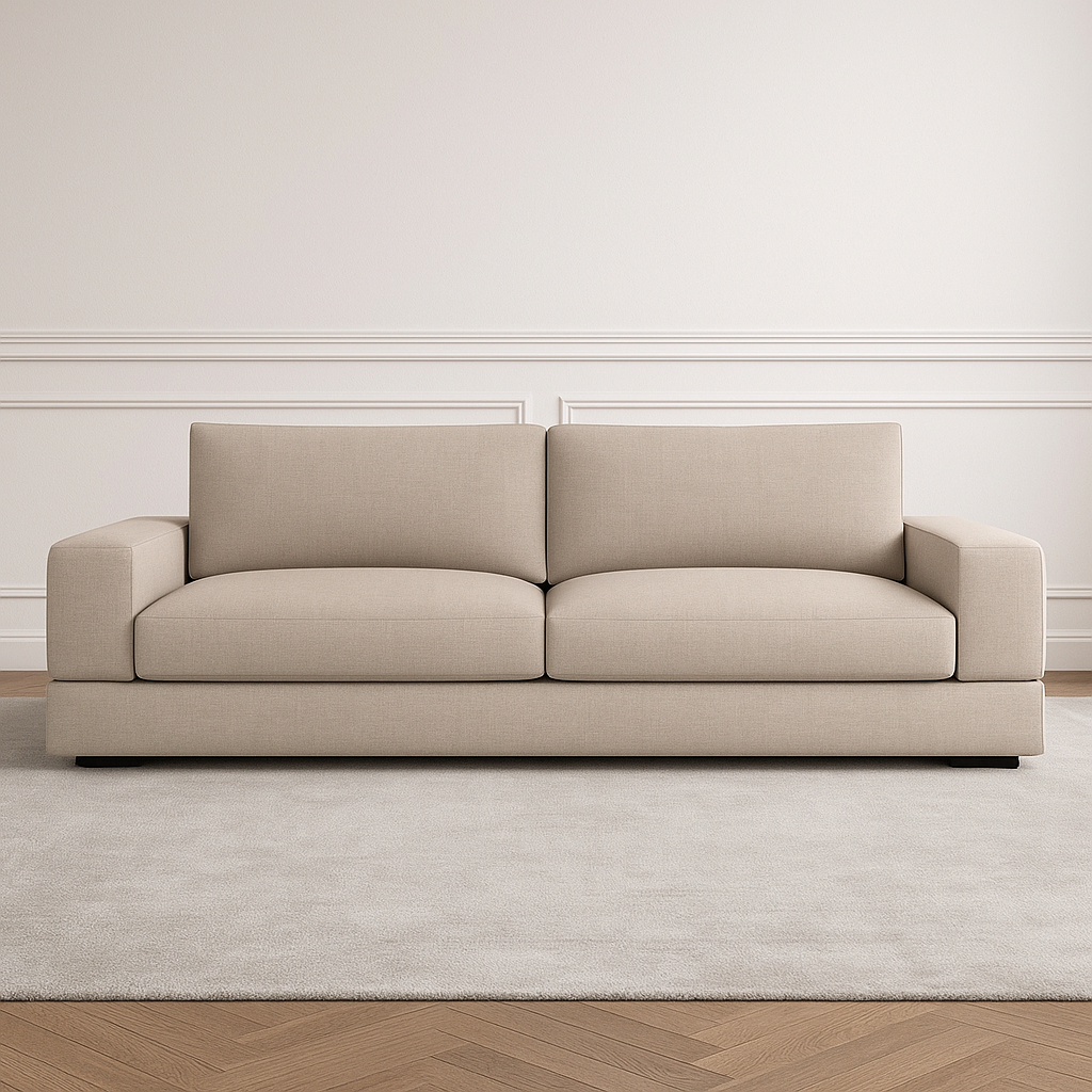 Beige fabric sofa on light rug and wood floor.