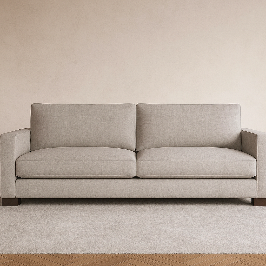 View of light gray sofa on rug and wood floor