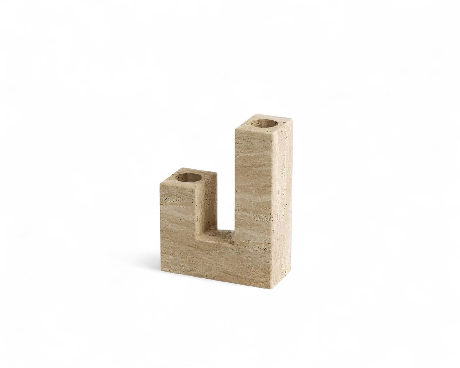 Beige travertine stone candelabra decor on white background
