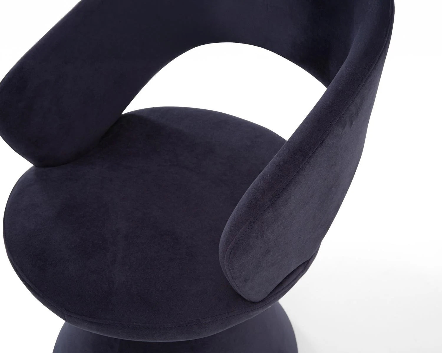 Close up view of dark blue velvet chair seat and backrest