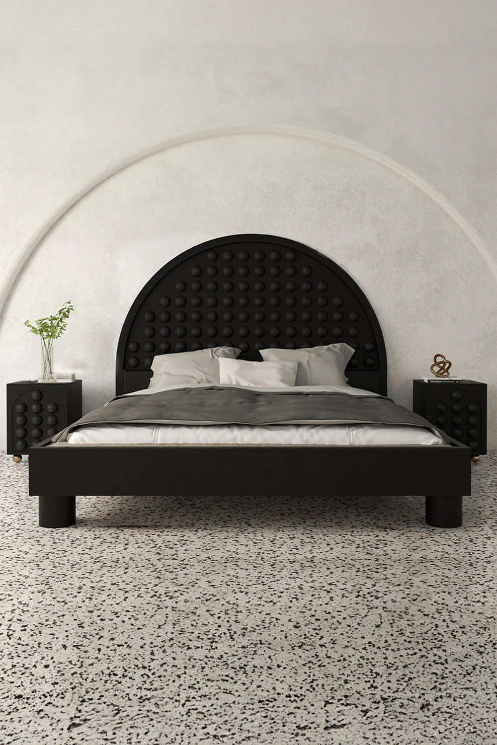 Bedroom view black bed nightstands textured headboard gray bedding