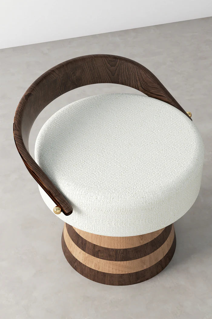 high angle view of white upholstered stool with wood base