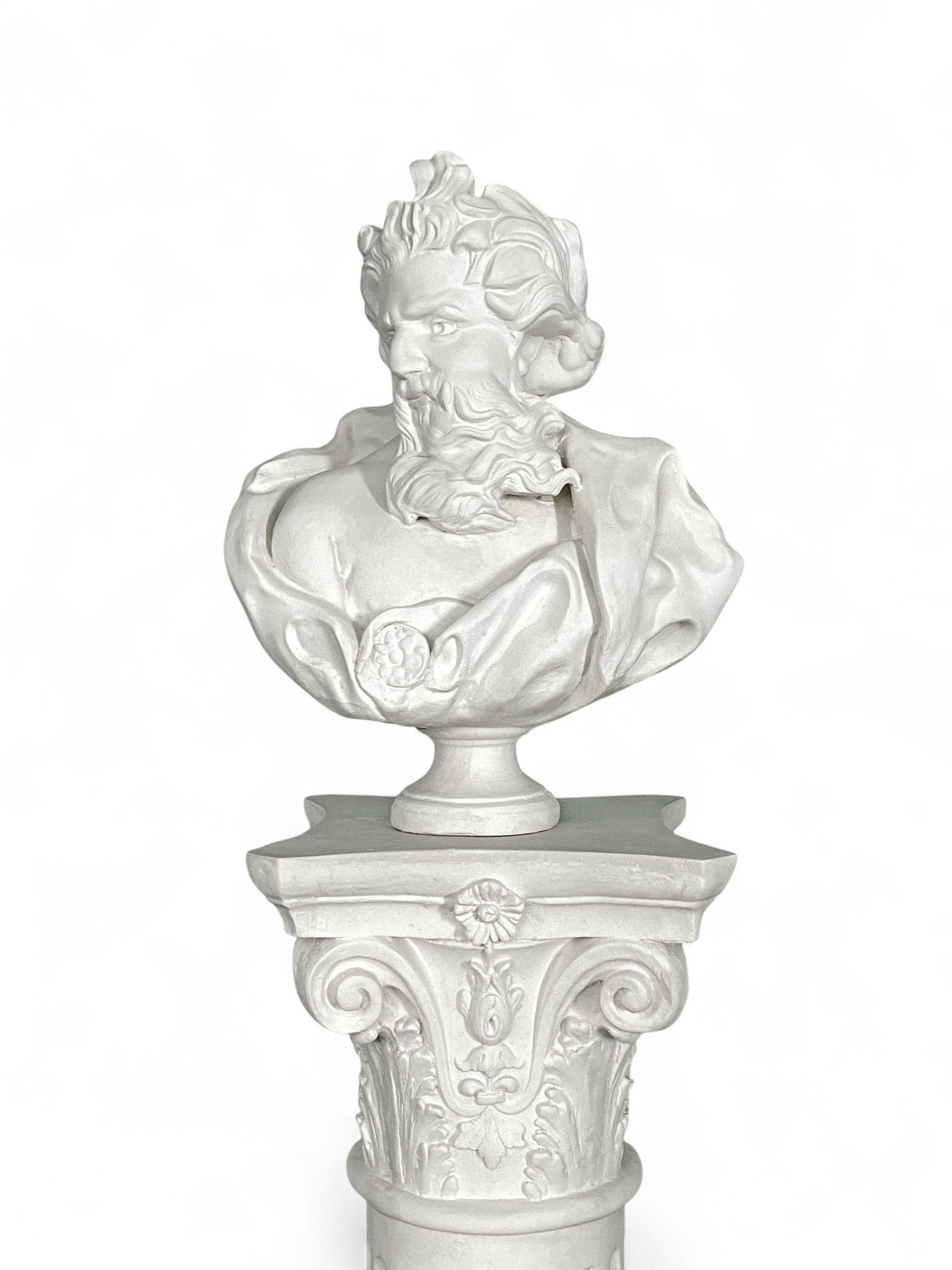White bust sculpture on decorative pedestal decor against white background