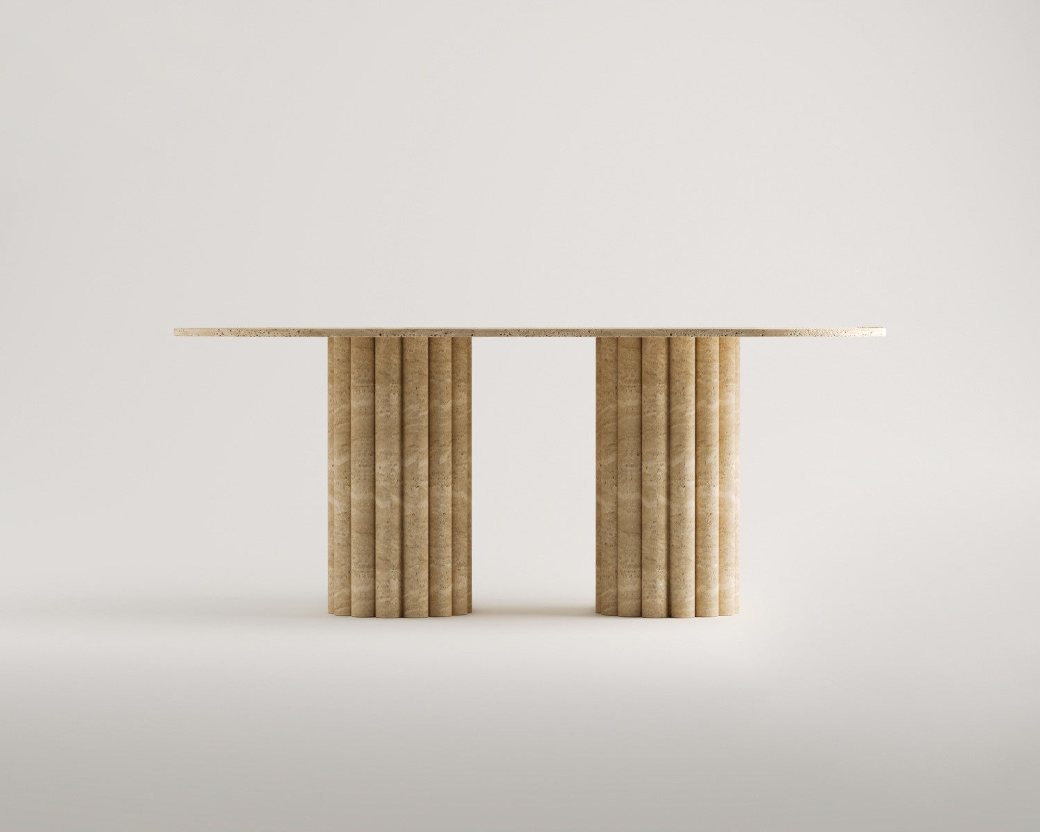 A minimalist travertine console table with fluted legs adds warmth and sophistication to any contemporary space.