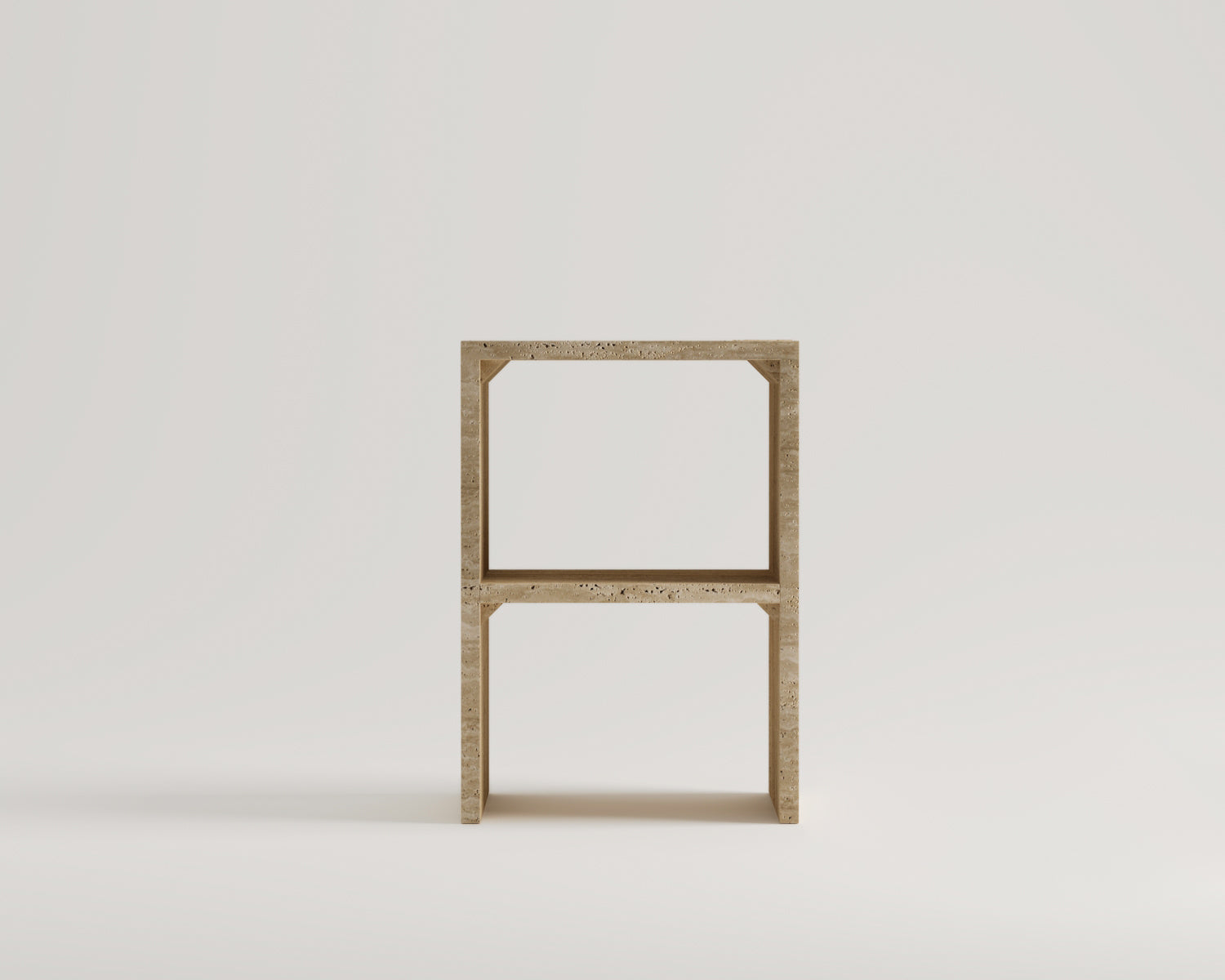 Front view of Luzione 206 travertine side table. Modern, minimalist design with open square frames and natural stone texture