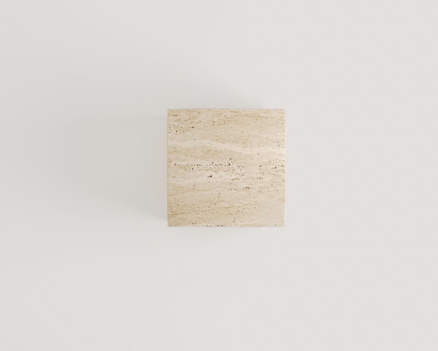 Top-down view of the Luzione Travertine Side Table. A modern, minimalist stone accent table perfect for living rooms or bedrooms