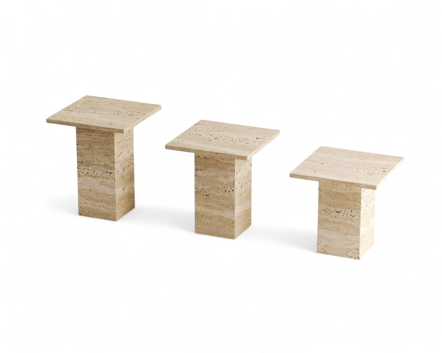 Three travertine stone square pedestal tables on white background