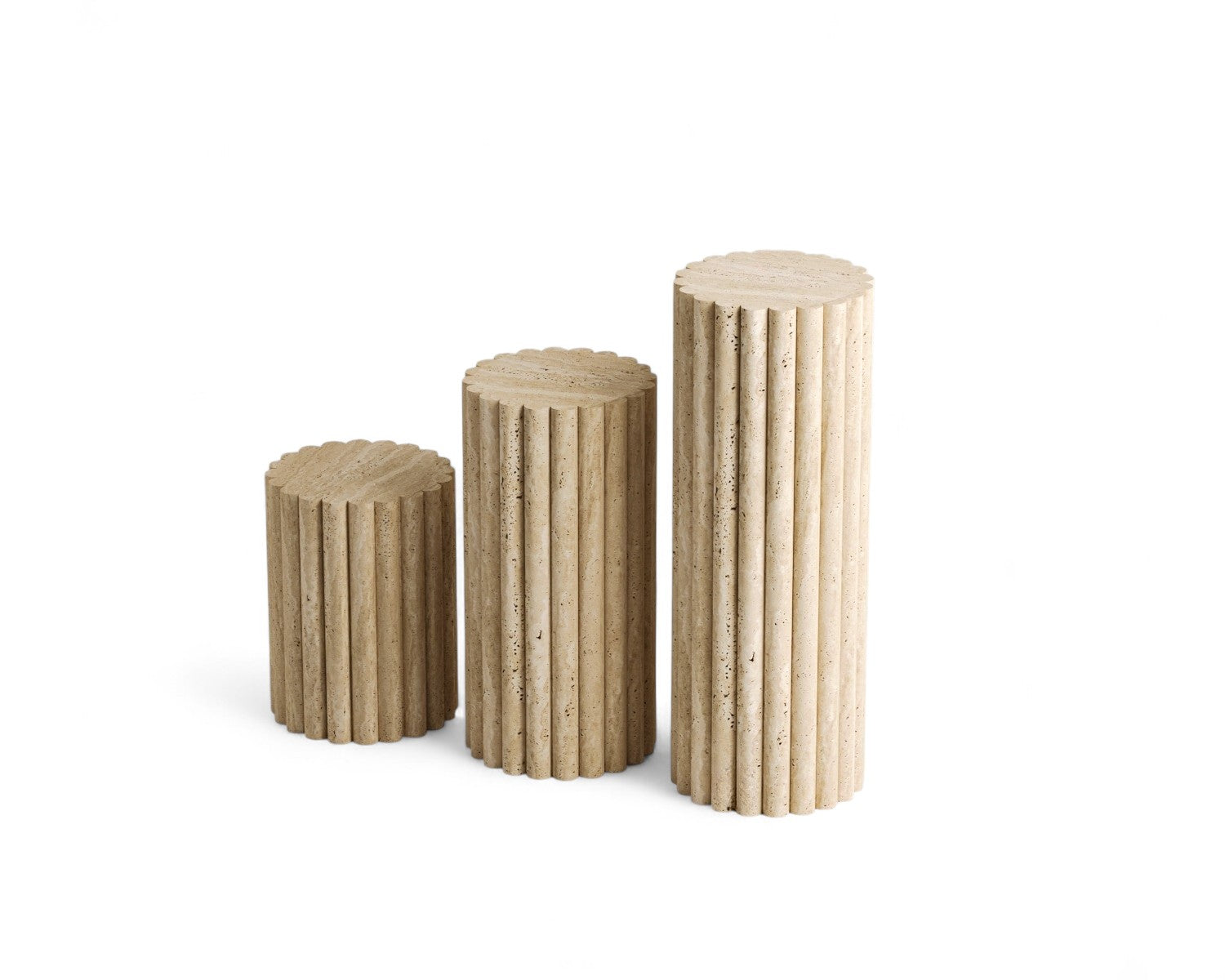 Three cylindrical fluted travertine pedestals of varying heights on white background.
Three cylindrical fluted travertine pedestals of varying heights.