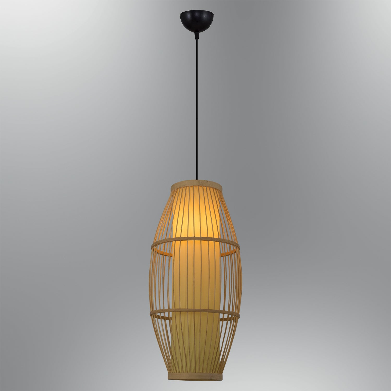 Studio shot of bamboo cage pendant lighting fixture with glowing shade