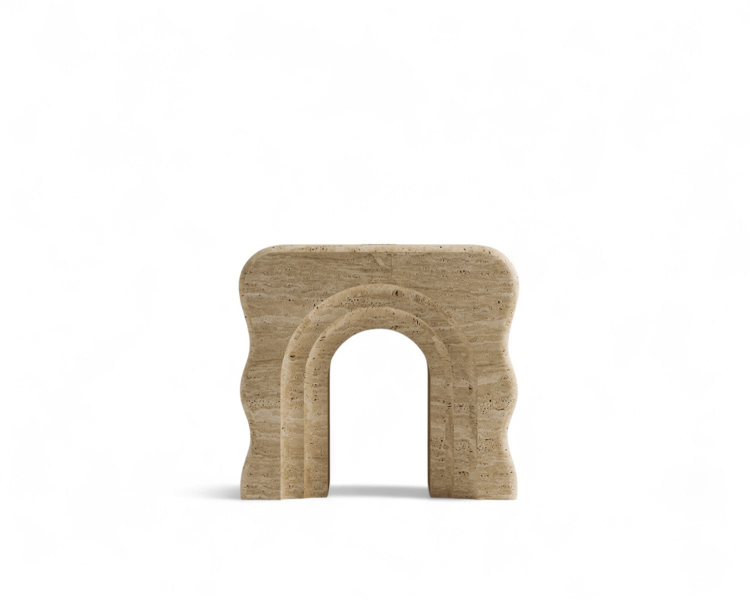 Studio shot of wavy travertine stone decor with arch opening