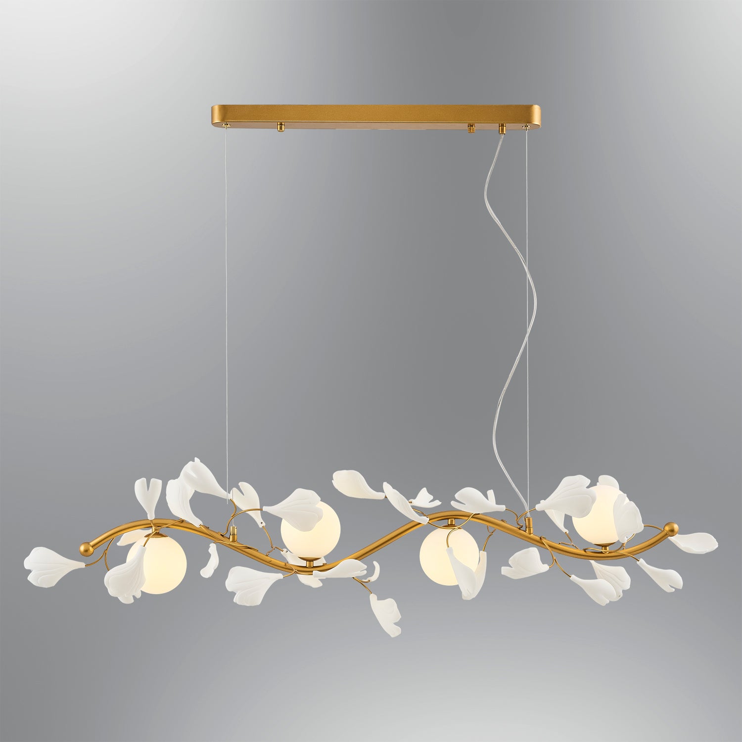 Gold metal branch chandelier with white leaf accents and glass globes