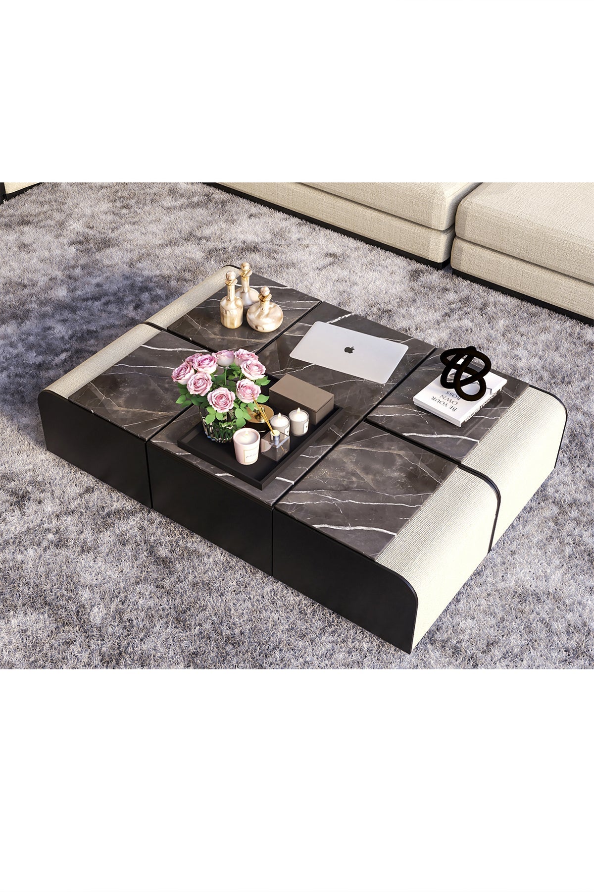 High angle view of modular marble coffee table on gray rug.