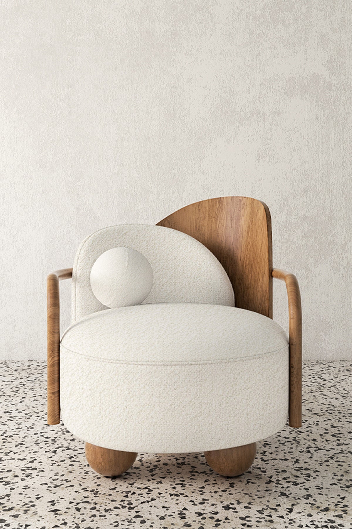 View of modern white upholstered armchair with wood back and arms, sitting on terrazzo floor.