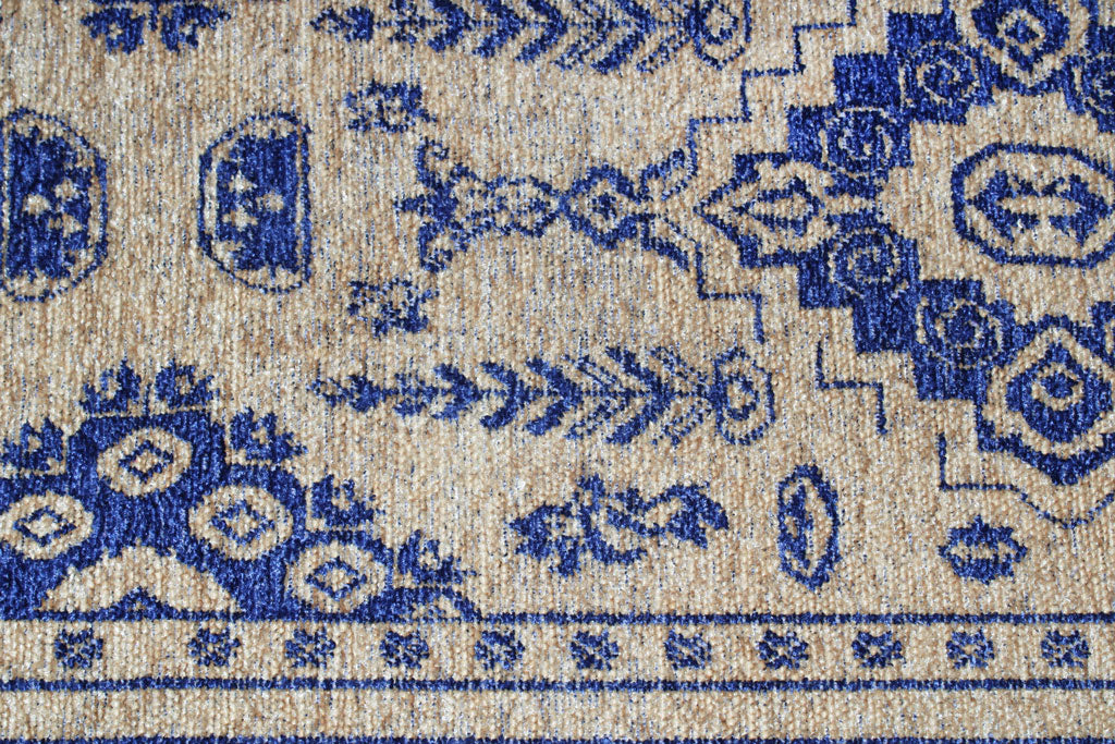 Close up view of beige and blue patterned rug texture