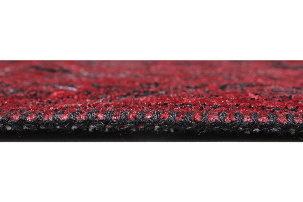 Close up view of red and black rug edge