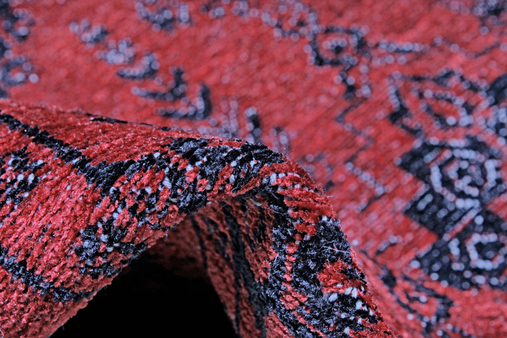 Close up of red and black patterned rug texture