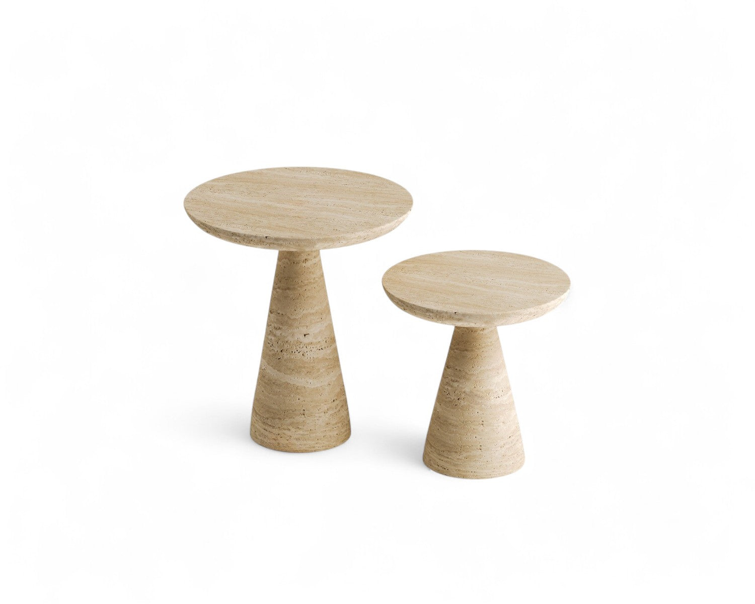 Studio shot of two travertine side tables on white background.