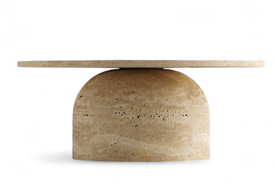 Studio shot of a round travertine coffee table on white background