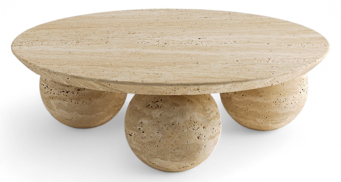 Round travertine coffee table with three spherical legs