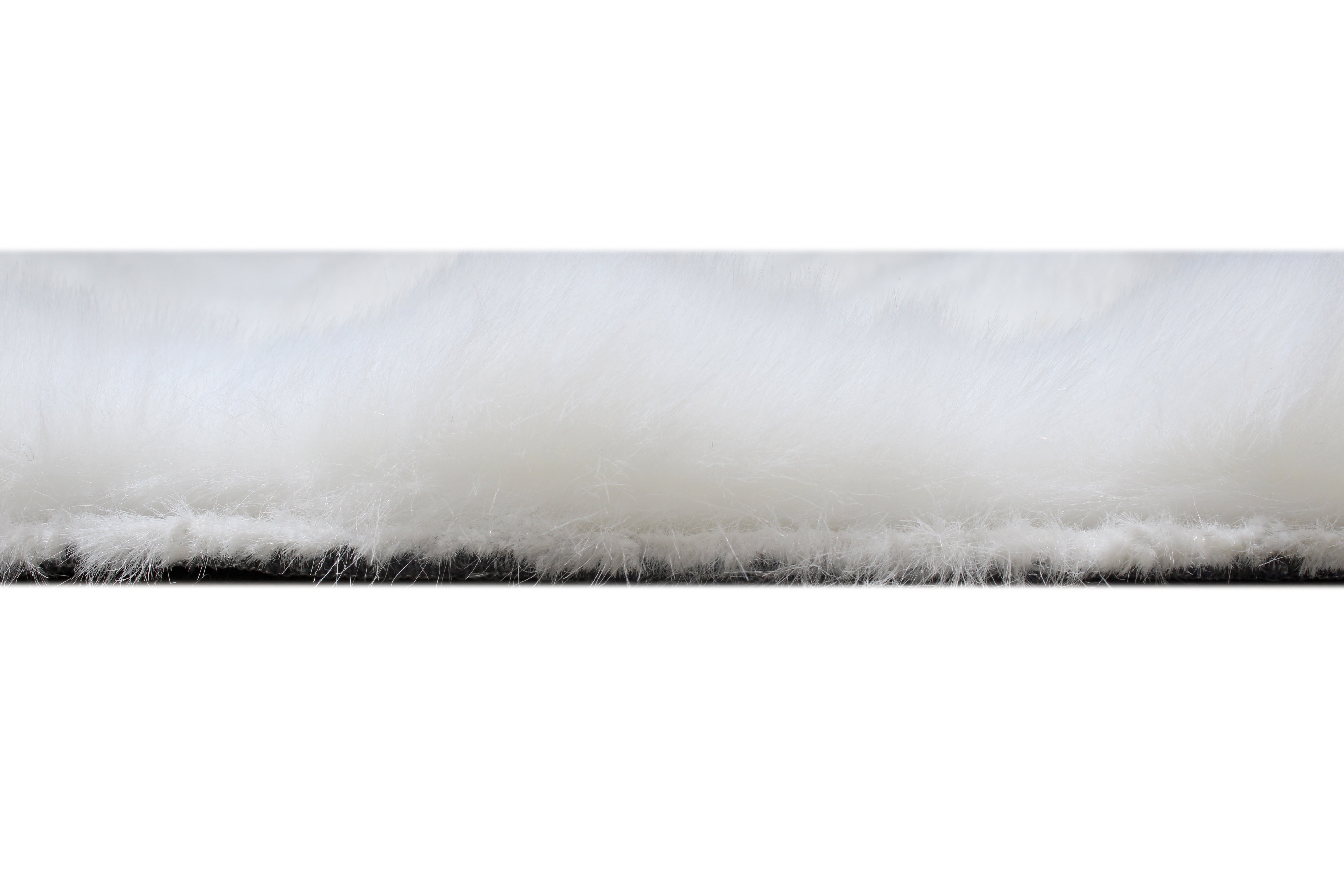 Close up view of white shag rug pile