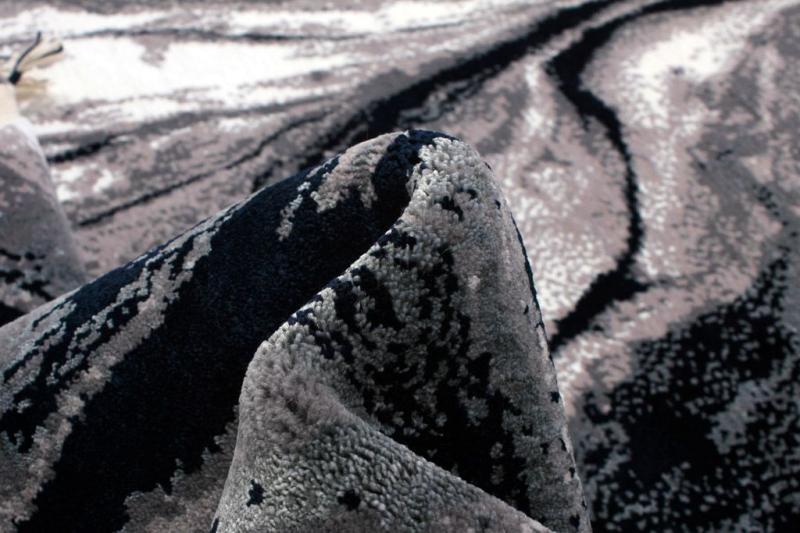 close up view of gray black patterned area rug