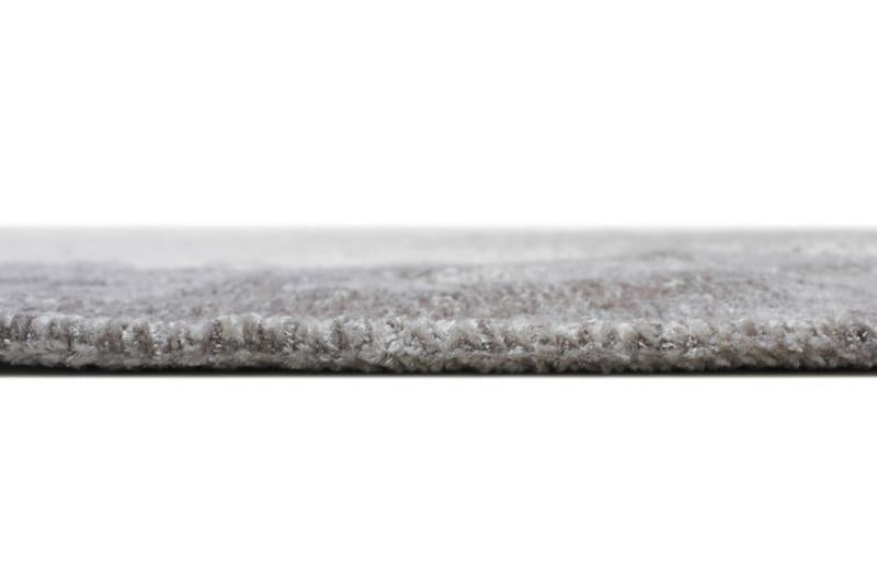 Close up view of gray rug edge and texture