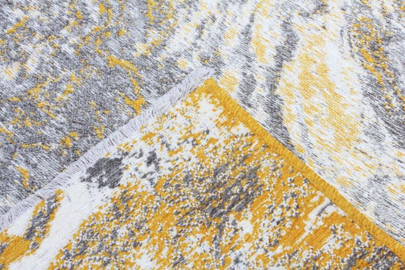 Close up view of abstract gray yellow white rug texture