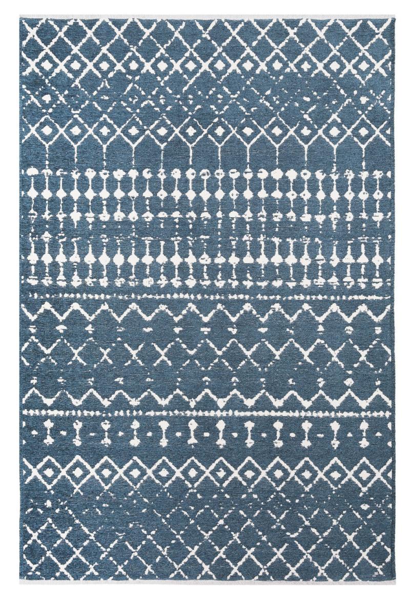 blue and white patterned area rug with geometric designs