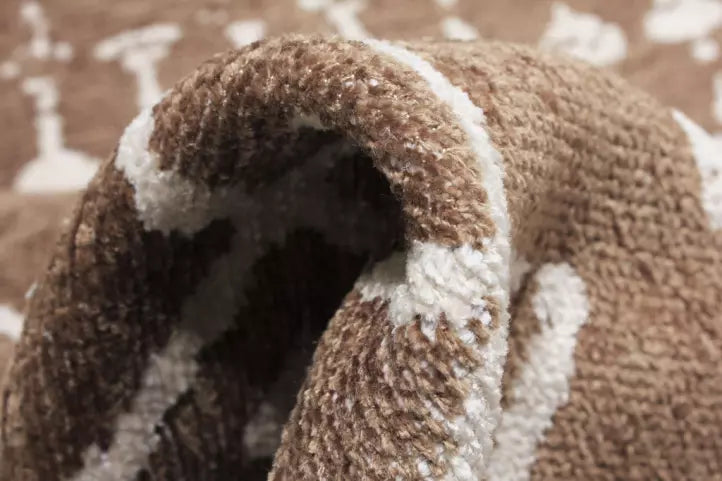 Close up view of brown and white patterned rug fiber