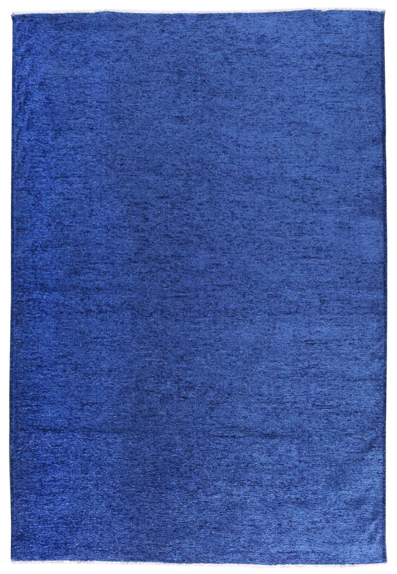 Close-up of Moretti Plain Rug's texture, highlighting the quality of its beige fibers.