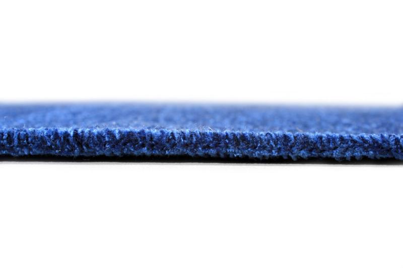 The side view of Moretti Plain Rug showcases its neutral blue design, which is perfect for modern home decor.