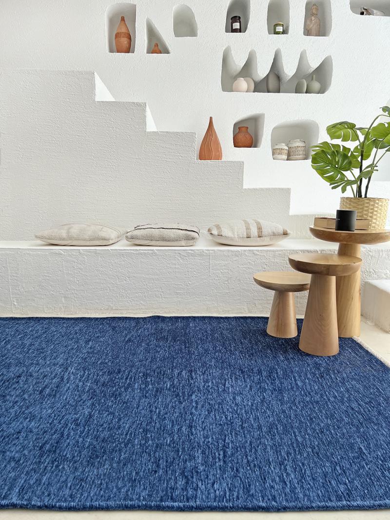 Moretti Plain Rug is displayed in a serene living room, illustrating its calming neutral tones.
