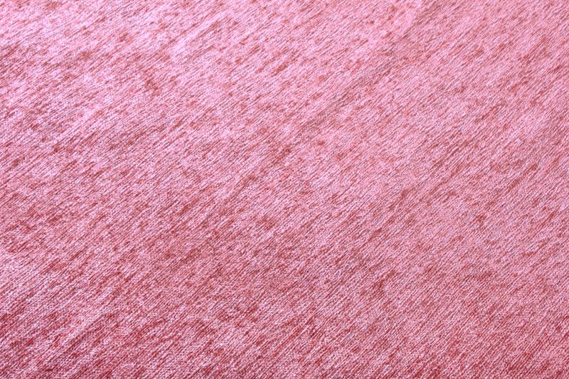 Close up view of pink fabric texture with diagonal lines